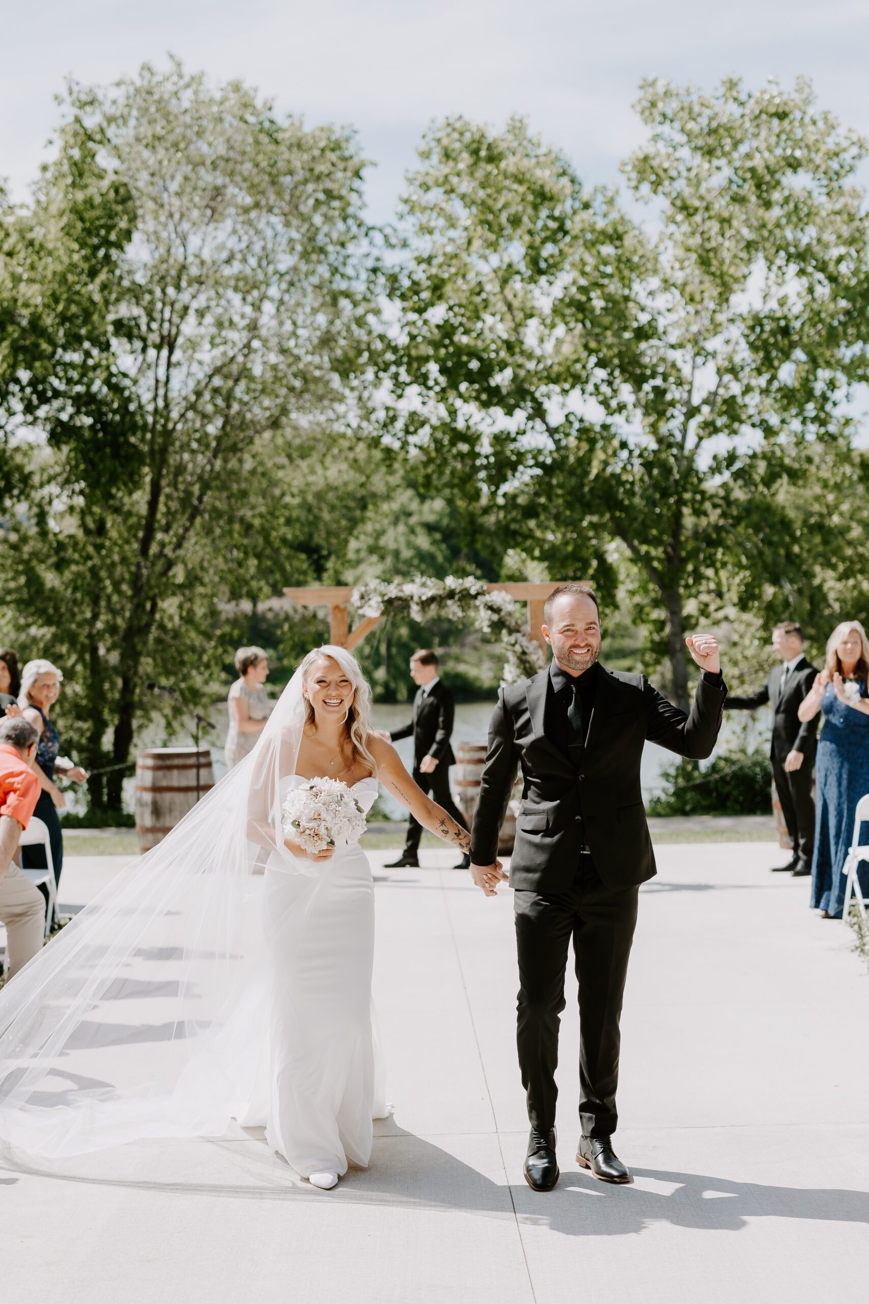 couple walking down the aisle after getting married